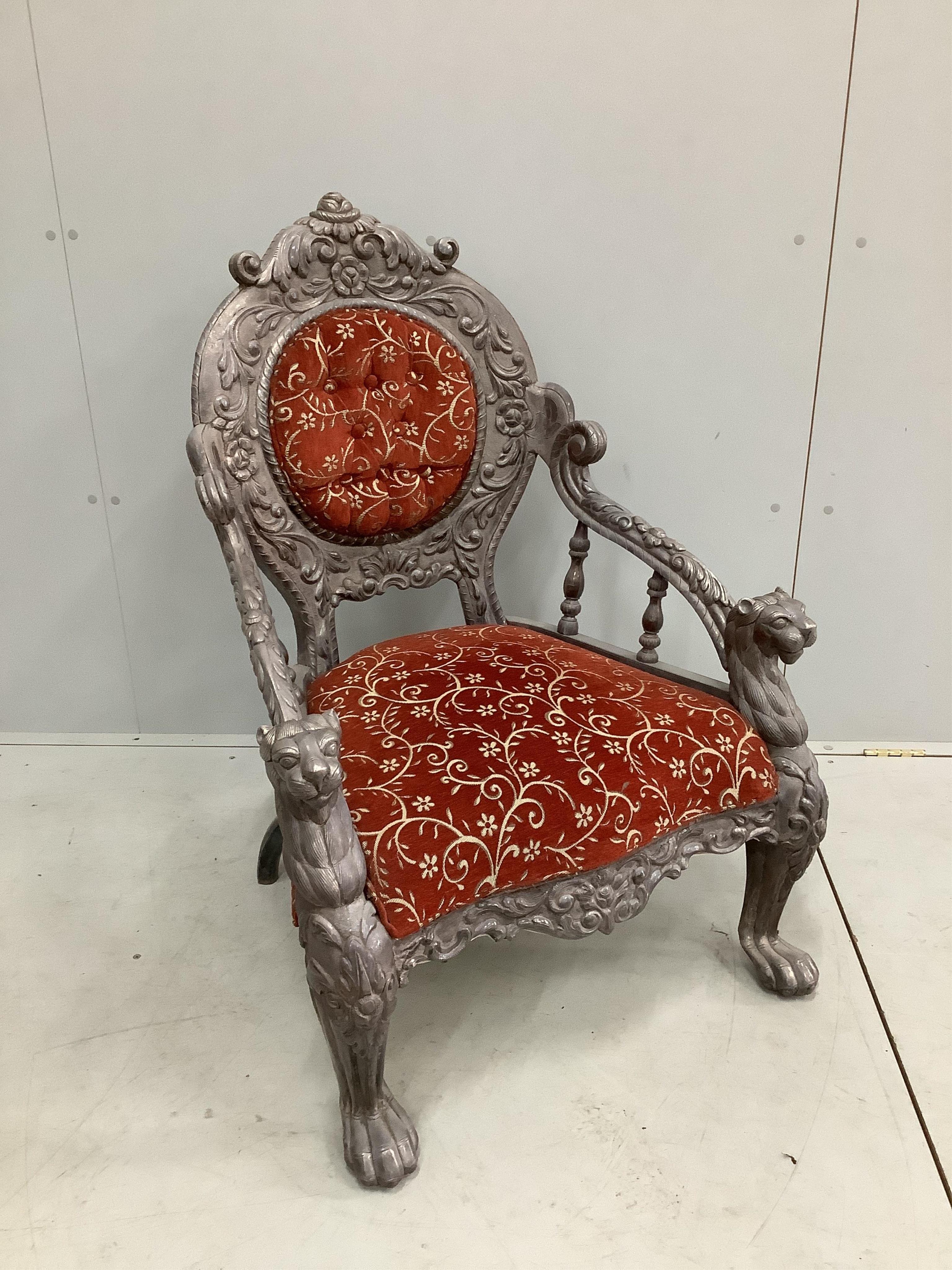 An Indian white metal overlaid armchair, width 72cm, depth 55cm, height 98cm. Condition - good